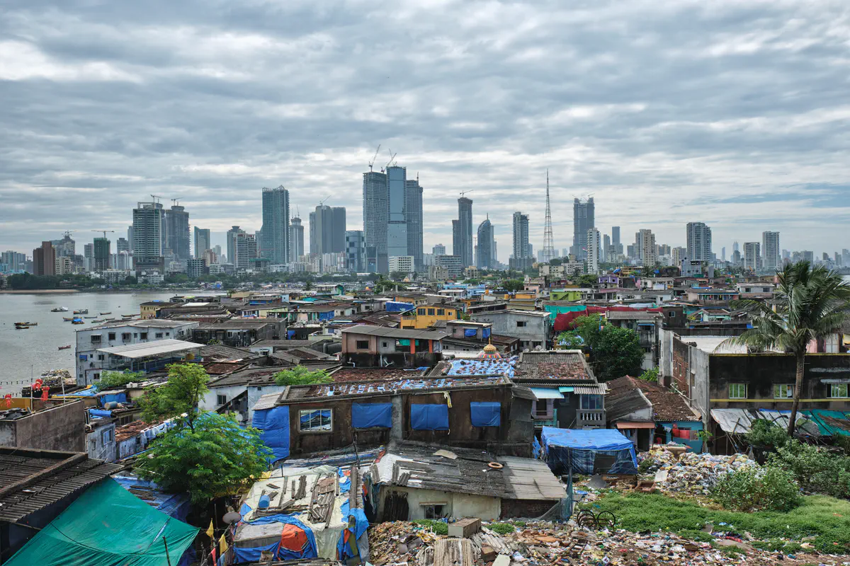 Mumbai slums with high towers in background